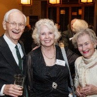 Three people pose for group photo
